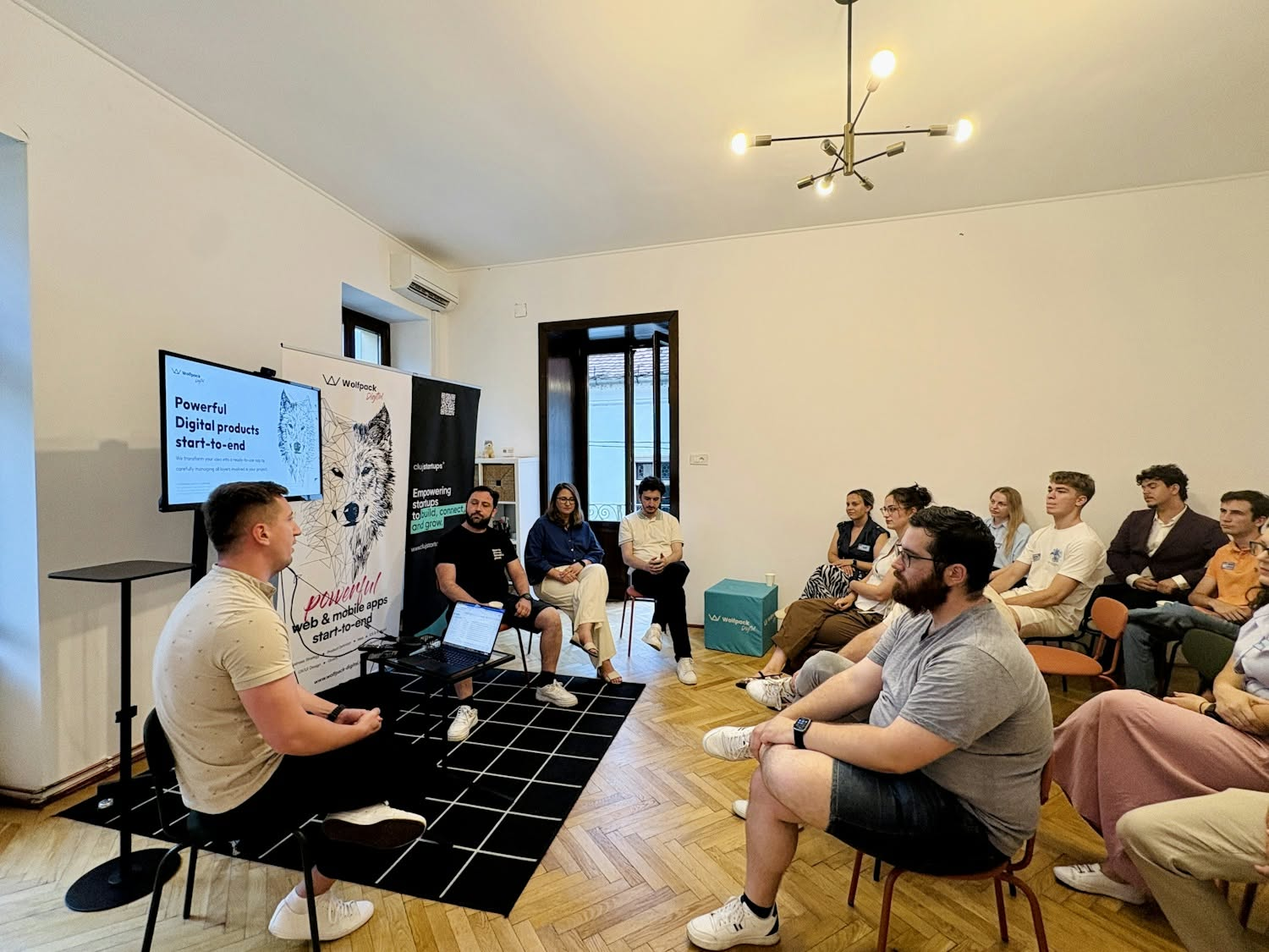 Wolfpack Digital speaks at a Cluj Startups community event, with a panel presenting on building digital products start-to-end to an engaged startup audience.