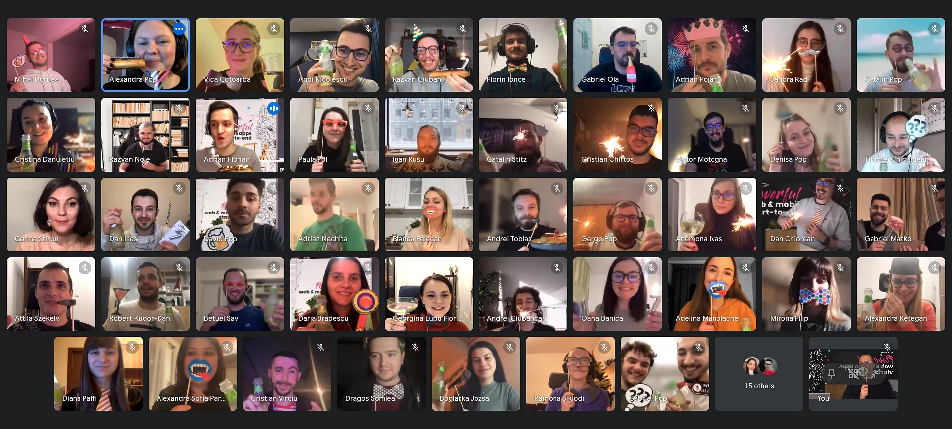 Video-call grid of the Wolfpack Digital team celebrating the company's 7th anniversary online with sparklers and drinks